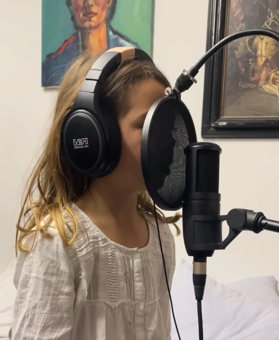 A child recording a lullaby in the studio